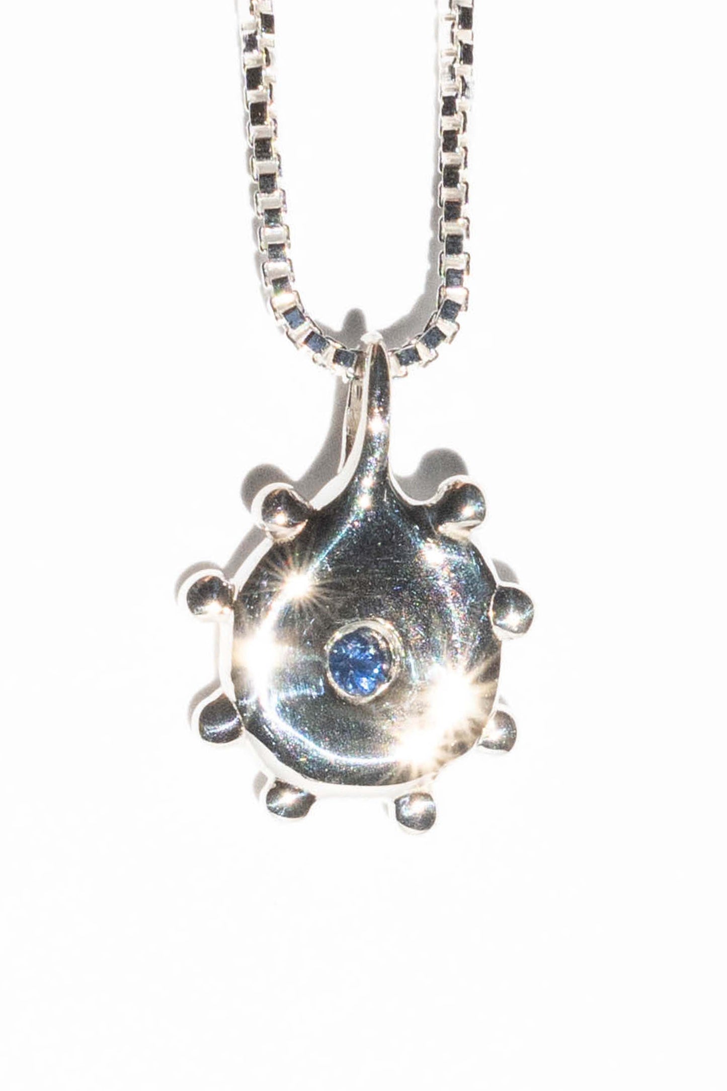 SOL in silver with blue sapphire