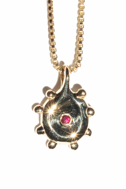 SOL in brass with ruby